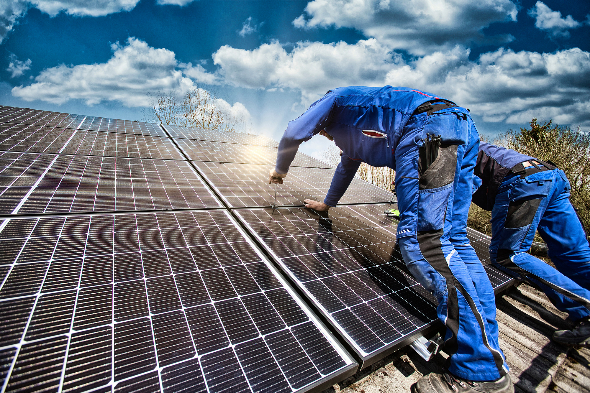 Installing solar photovoltaic panel system. Solar panel technici